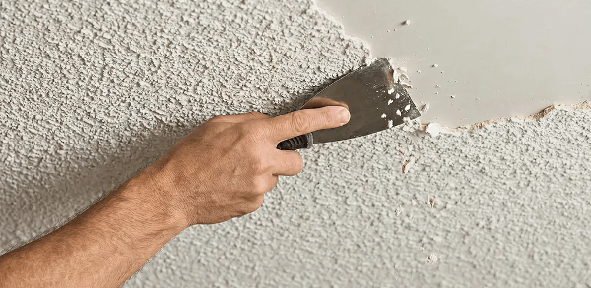 Popcorn ceiling removal scraping off textured ceiling finish in Tempe, AZ