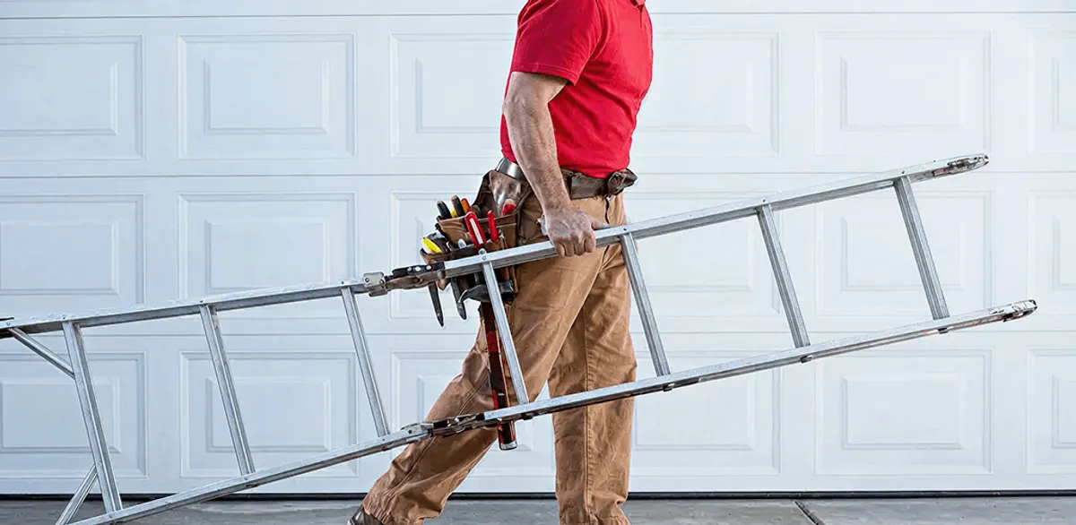 Garage door repair technician arriving with tools and ladder in Tempe, AZ