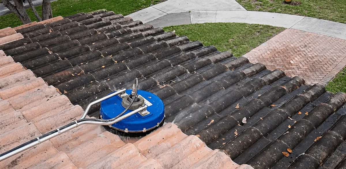 Roof pressure cleaning removing debris and buildup from roof tiles in Tempe, AZ